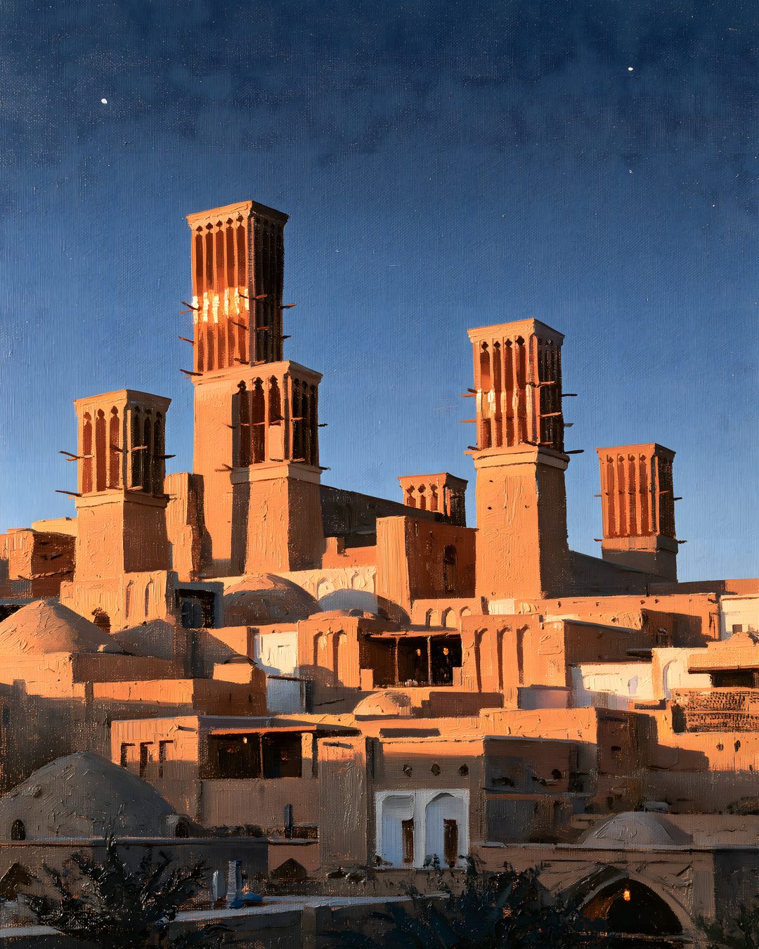 Torres de viento de Yazd encendidas por el último sol bajo un cielo azul con estrellas